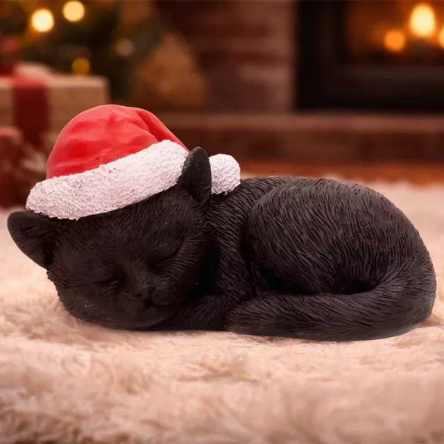 Karácsonyi dísz Jingle Paws - Sleeping Black Cat in Santa Hat (Nemesis Now) - Nemesis Now